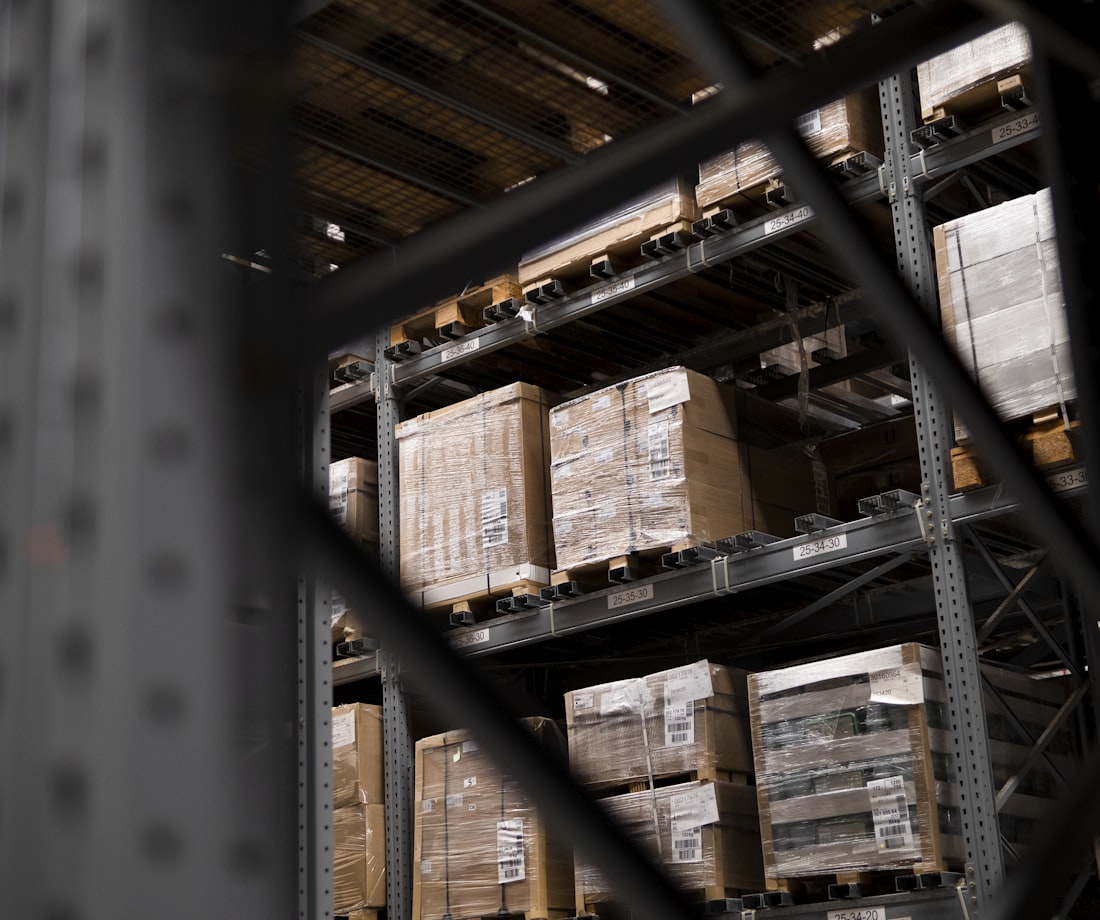 Warehouse racking stacked with palletised cartons
