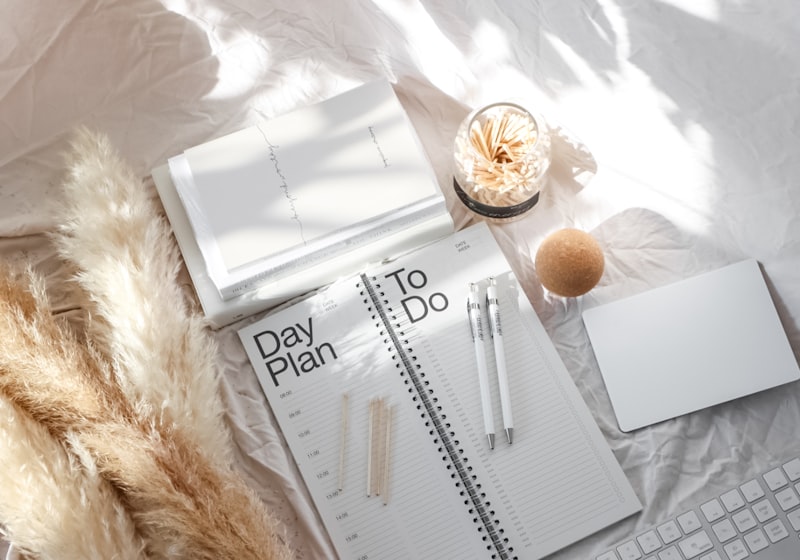 Wire-bound notepads laid flat on a pale surface